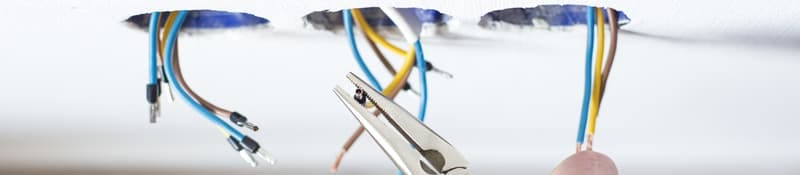 Electrician performing rewiring work